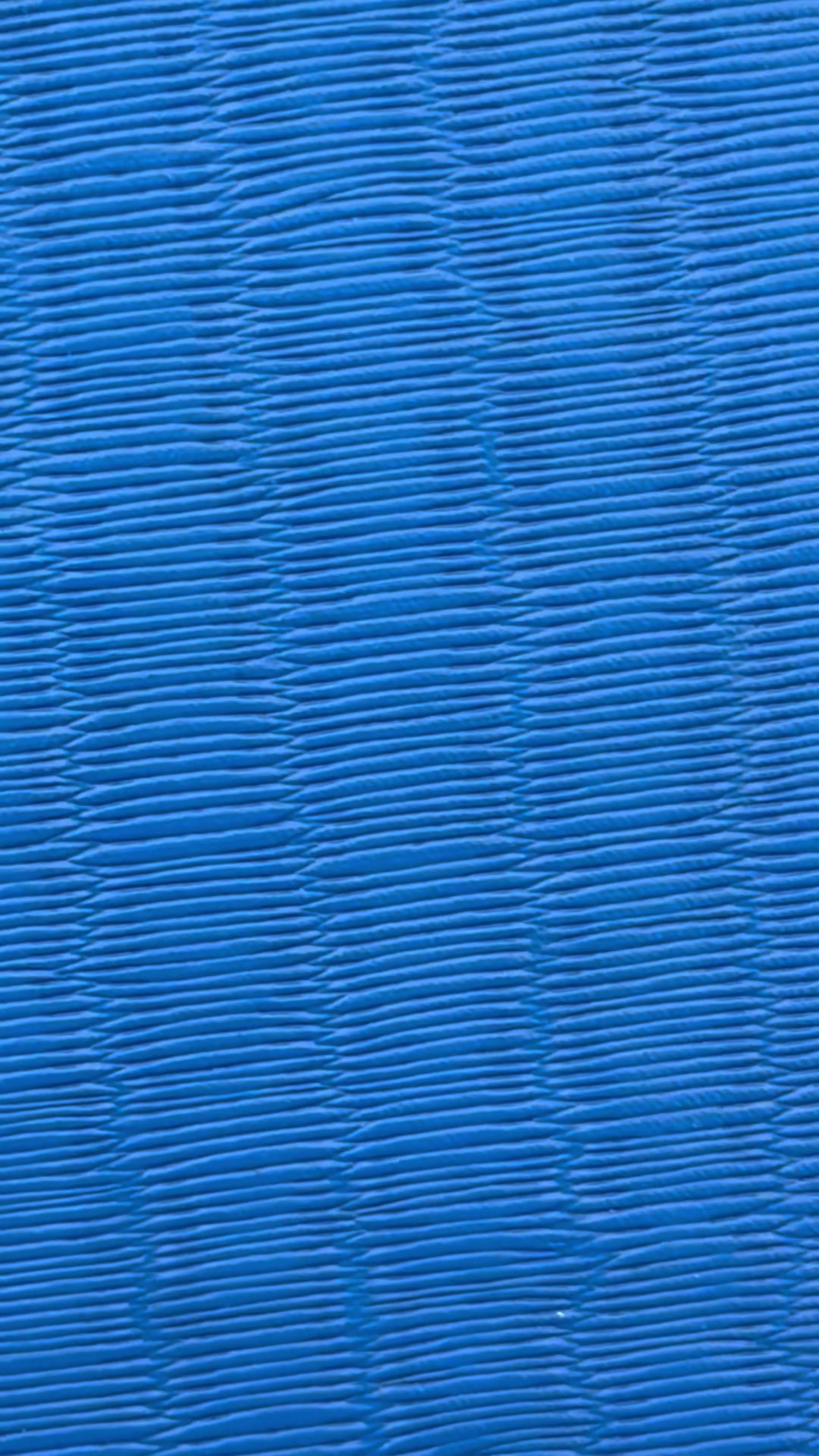 Blue ribbed wrestling mat after professional deep cleaning
